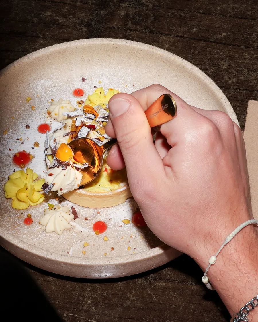 Finishing the saffron tart at the pass